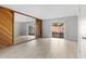 A bedroom featuring light-colored floors, a mirrored closet, and sliding glass doors to the outside at 4825 Lighthouse Cir # 4825, Orlando, FL 32808