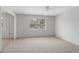 Spacious bedroom with natural light, ceiling fan, and mirrored closet at 4825 Lighthouse Cir # 4825, Orlando, FL 32808