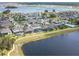 Neighborhood aerial view showcasing lakeside properties and community layout at 5647 Barletta Dr, St Cloud, FL 34771