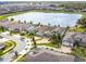 An aerial view shows a home with a lake view in a serene community at 5647 Barletta Dr, St Cloud, FL 34771