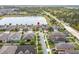 An aerial view shows a home with a lake view in a serene community at 5647 Barletta Dr, St Cloud, FL 34771