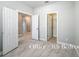 Bedroom/office with tile floors and three doors for accessibility to closet and hallway at 5647 Barletta Dr, St Cloud, FL 34771