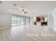Bright open concept kitchen with stainless steel appliances and large format tile at 5647 Barletta Dr, St Cloud, FL 34771