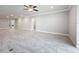 Large great room with tile floors and neutral colors offers flexibility for furniture arrangement and decor styles at 5647 Barletta Dr, St Cloud, FL 34771
