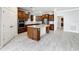 Gourmet kitchen boasts granite countertops, stainless steel appliances, and ample cabinet space for storage at 5647 Barletta Dr, St Cloud, FL 34771