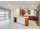 Modern kitchen featuring a large island, stainless steel appliances, and granite countertops, perfect for cooking at 5647 Barletta Dr, St Cloud, FL 34771