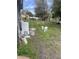 Wide backyard with a combination of grass and bare ground, some clutter at 5915 Colchester Dr, Orlando, FL 32812