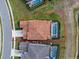 Aerial view of home with pool and red tile roof within property lines at 7805 Oak Reflection Loop, Davenport, FL 33837