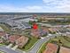 Expansive aerial view showcasing the beautiful community, ponds, and surrounding landscape at 7805 Oak Reflection Loop, Davenport, FL 33837