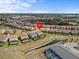 Aerial view of the neighborhood showcasing properties with pools and picturesque community features at 7805 Oak Reflection Loop, Davenport, FL 33837