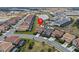 Beautiful aerial view of the neighborhood highlighting landscaping, nearby pond, and modern home exteriors at 7805 Oak Reflection Loop, Davenport, FL 33837