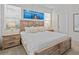 A comfortable bedroom featuring wood furniture, a decorative light fixture, and a calm ambiance at 7805 Oak Reflection Loop, Davenport, FL 33837