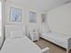 Bright bedroom featuring twin beds, a neutral color palette and decorative wall art at 7805 Oak Reflection Loop, Davenport, FL 33837