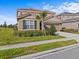 Attractive two-story home with a tile roof, a lush lawn, and a two-car garage at 7805 Oak Reflection Loop, Davenport, FL 33837