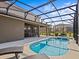 Well-maintained pool area with a relaxing outdoor dining and seating area at 7805 Oak Reflection Loop, Davenport, FL 33837