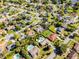 Aerial image of the property in a quiet neighborhood with pools and mature trees at 8992 Palos Verde Dr, Orlando, FL 32825