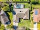 Overhead view of a home with a screened-in pool, lush backyard, and well-kept landscaping at 8992 Palos Verde Dr, Orlando, FL 32825