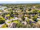 Aerial view of a property in a lush, green neighborhood with mature trees and spacious yards at 8992 Palos Verde Dr, Orlando, FL 32825