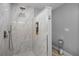 Beautifully tiled marble shower with built-in shelves at 8992 Palos Verde Dr, Orlando, FL 32825