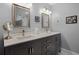 Renovated bathroom with double vanity, quartz counters, and modern fixtures at 8992 Palos Verde Dr, Orlando, FL 32825