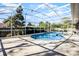 An inviting screened pool and spa combination with ample deck space is perfect for enjoying sunny days at 8992 Palos Verde Dr, Orlando, FL 32825