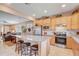 Eat-in kitchen features stainless steel appliances, granite counters, and barstool seating at 9673 Sw 63Rd Loop, Ocala, FL 34481