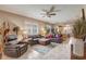 Inviting living room features tile flooring, neutral walls, and stylish leather furniture set at 9673 Sw 63Rd Loop, Ocala, FL 34481