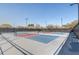 Outdoor pickleball court featuring multiple, colorful playing surfaces and lighting for evening games at 9673 Sw 63Rd Loop, Ocala, FL 34481