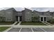 Modern townhome complex features clean lines, stone accents, and manicured landscaping at 992 Leader St, Davenport, FL 33896