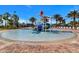 Charming splash pad area with water features and lounge chairs, perfect for Gathering-friendly fun on sunny days at 992 Leader St, Davenport, FL 33896