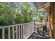 Secluded outdoor balcony featuring peaceful views of lush surrounding greenery at 1001 Park Ridge Cir, Kissimmee, FL 34746