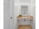 Well-lit bathroom with a convenient vanity, perfect for getting ready in the morning, and ample lighting at 1001 Park Ridge Cir, Kissimmee, FL 34746