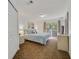 Comfortable bedroom with plush carpeting, balcony access, and a relaxing atmosphere at 1001 Park Ridge Cir, Kissimmee, FL 34746