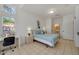Bright bedroom with desk area, tiled flooring, and plenty of natural light at 1001 Park Ridge Cir, Kissimmee, FL 34746