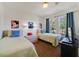 Charming bedroom with two twin beds, playful decor, and a cozy atmosphere for restful nights at 1001 Park Ridge Cir, Kissimmee, FL 34746