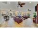 Spacious lounge area with comfortable seating, ceiling fans, and views of the community pool at 1001 Park Ridge Cir, Kissimmee, FL 34746