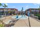 Community splash pad area with playful water features and nearby lounge chairs at 1001 Park Ridge Cir, Kissimmee, FL 34746