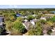 Aerial view of a residential community with lush greenery and a lake at 10081 Cobalt Bay Rd, Orlando, FL 32827