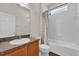 Bright bathroom featuring tub-shower combo and vanity sink at 10081 Cobalt Bay Rd, Orlando, FL 32827