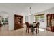 Bright dining room with display cabinet and tile floors at 10081 Cobalt Bay Rd, Orlando, FL 32827