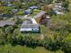 Aerial view of the home featuring a spacious backyard and screened in patio in a verdant neighborhood at 1021 Mare Bello Dr, Winter Park, FL 32792