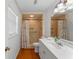 Bathroom featuring a vanity, toilet, and tiled walk-in shower at 1021 Mare Bello Dr, Winter Park, FL 32792