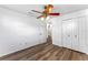 Clean bedroom includes wood flooring, ceiling fan, closet and en-suite bathroom at 1021 Mare Bello Dr, Winter Park, FL 32792