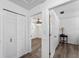Hallway view of bedroom and closet with wood floors at 1021 Mare Bello Dr, Winter Park, FL 32792