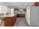 Well-lit kitchen with modern appliances, a center island, and hardwood flooring throughout at 1021 Mare Bello Dr, Winter Park, FL 32792