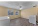 Large laundry room with washer and dryer hookups, two windows, and modern floors at 1021 Mare Bello Dr, Winter Park, FL 32792