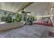 Enjoy the outdoors on this screened patio with wood look floors and beautiful landscape at 1021 Mare Bello Dr, Winter Park, FL 32792