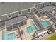 Aerial view of a home with two screened in private pools and outdoor living spaces at 1106 Kingsbarn St, Davenport, FL 33896