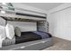 Functional bedroom displaying a bunk bed, closet and cozy carpet, perfect for maximizing space at 1106 Kingsbarn St, Davenport, FL 33896