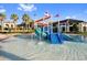 Community splash pool featuring a fun slide, water features, and lounge area at 1106 Kingsbarn St, Davenport, FL 33896